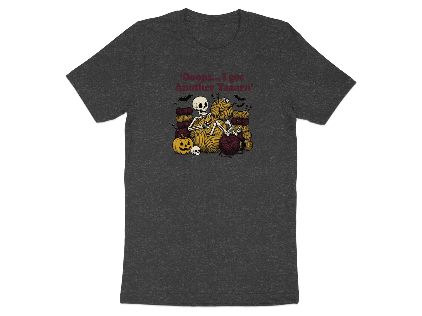 Skeleton knitting with yarn balls, pumpkin, and bats, text reads "Oops... I got Another Yaaarn".