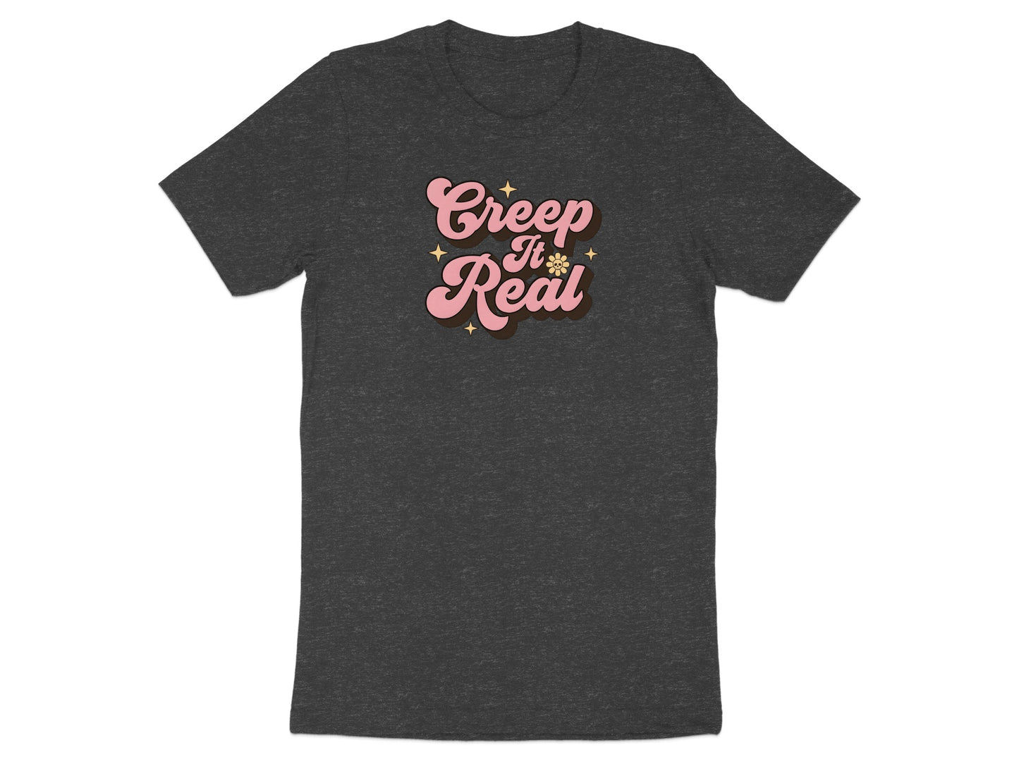 Dark gray t-shirt with "Creep It Real" text in pink retro font.