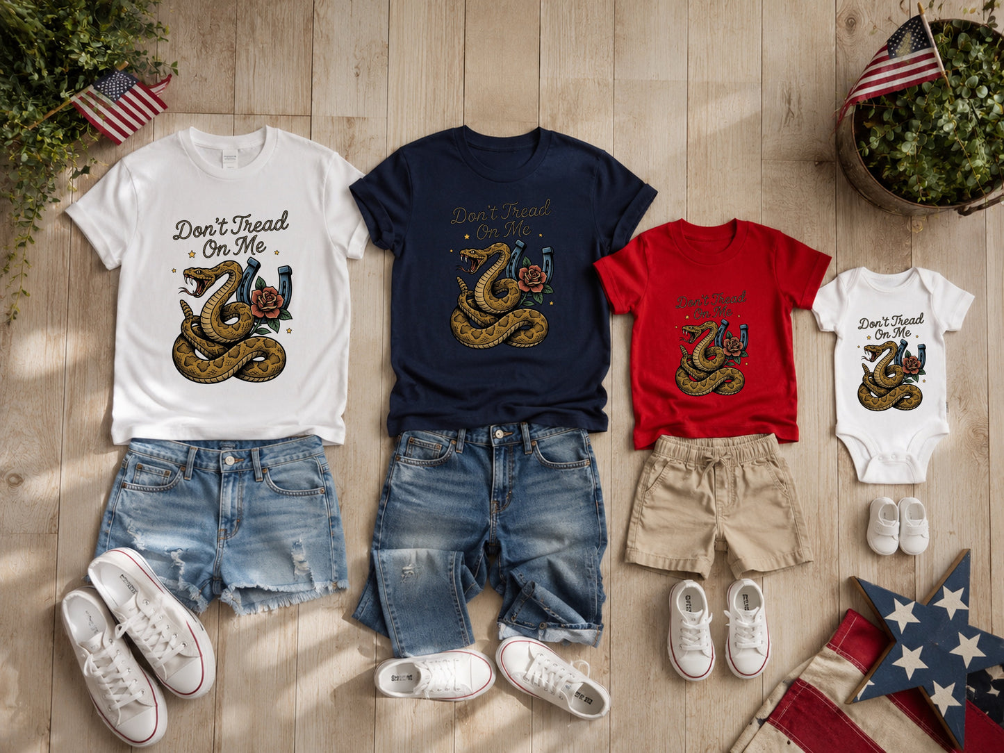 T-shirts and bodysuit with snake and "Don't Tread On Me" graphic.