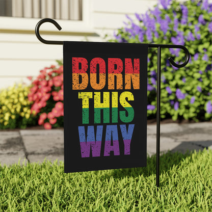 Black garden flag with "Born This Way" in rainbow LGBTQ+ colors.