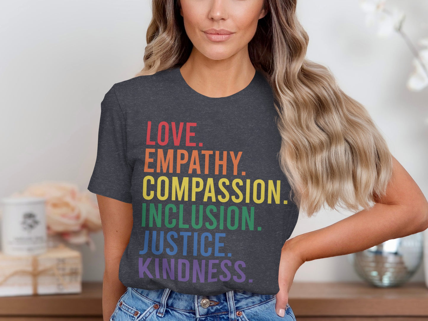 Dark t-shirt with rainbow text: LOVE. EMPATHY. COMPASSION. JUSTICE. KINDNESS.