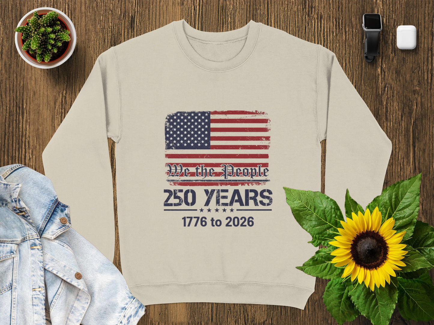 Crewneck sweatshirt with distressed American flag and text "We The People 1776 to 2026".