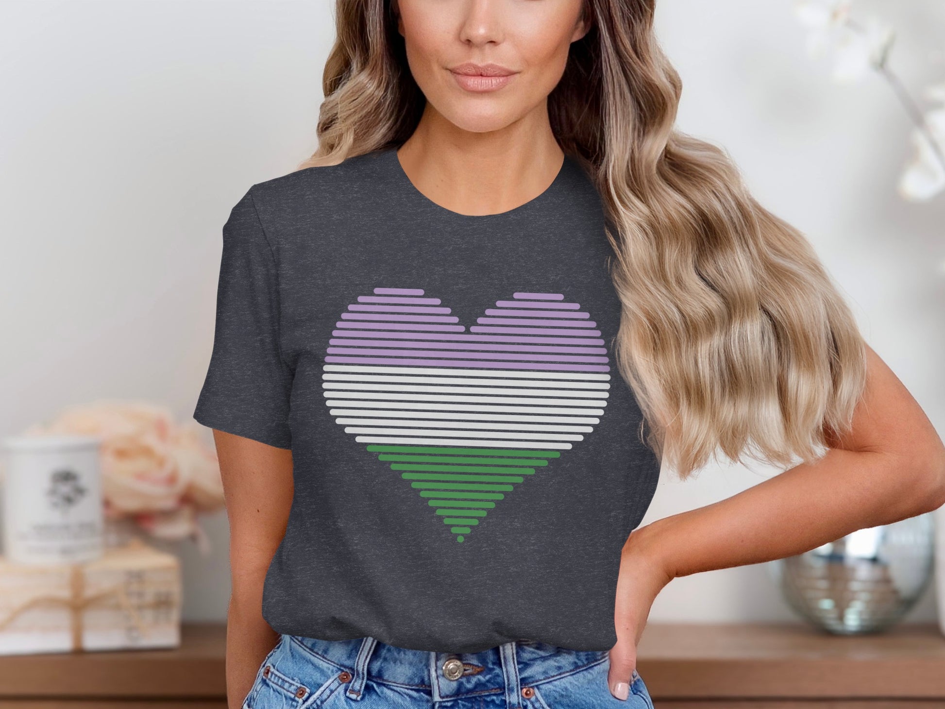 Dark t-shirt with a horizontal striped genderqueer pride flag heart graphic.