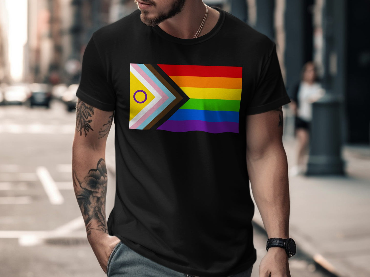 Black t-shirt with the inclusive pride flag design on the chest.