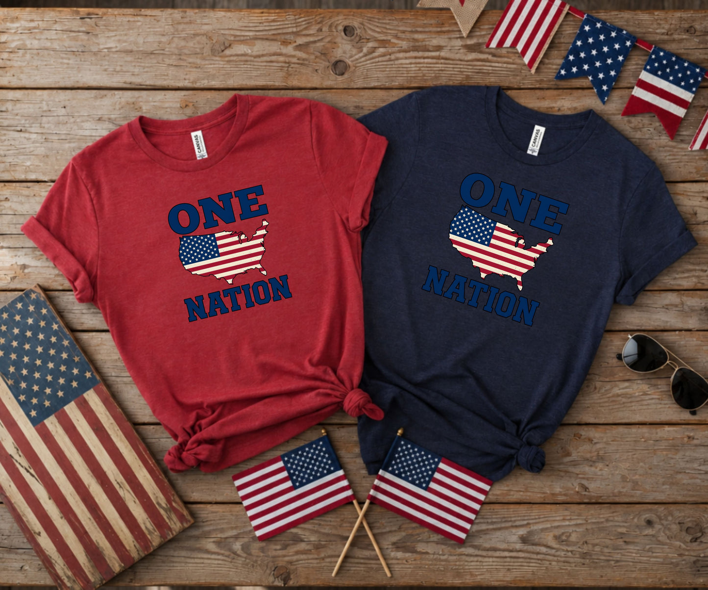 Two t-shirts with "One Nation" and US flag map design.