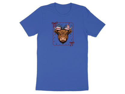 Highland cow with American flag bow on blue t-shirt.
