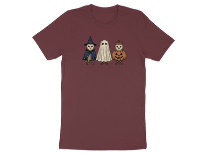 Owls dressed as a witch, ghost, and jack-o'-lantern on a maroon t-shirt.