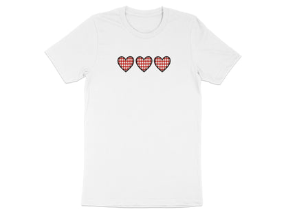 White t-shirt with three red and white gingham hearts embroidered on the chest.