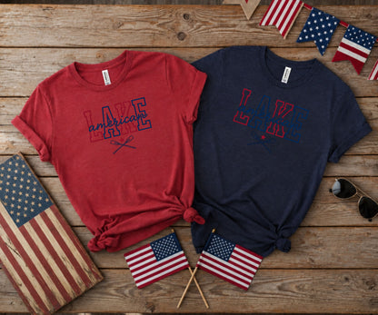 Two t-shirts with "Lake Life" text and crossed oars, with American flags.