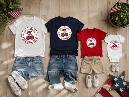 Four children's patriotic "Little Miss Firecracker" t-shirts and onesie.