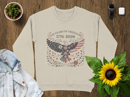 Cream sweatshirt with eagle and floral wreath, "250 Years of Freedom 1776-2026".