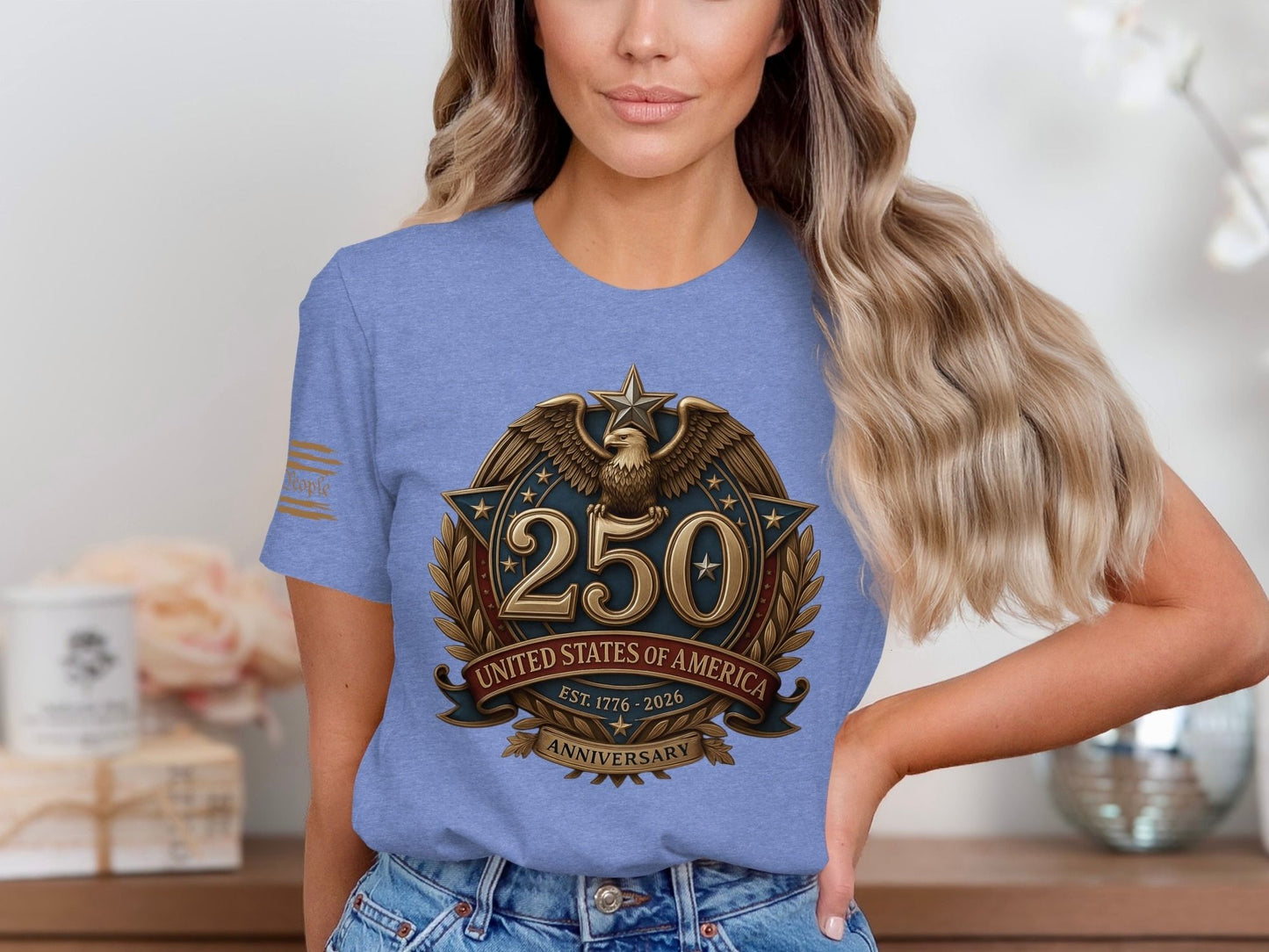 Blue t-shirt with "250 United States of America Anniversary Est. 1776-2026" emblem.