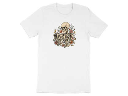 Skeleton holding playing cards surrounded by flowers and leaves.