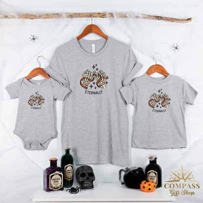 Three grey t-shirts with skeleton hand graphic and "Eternally" text.