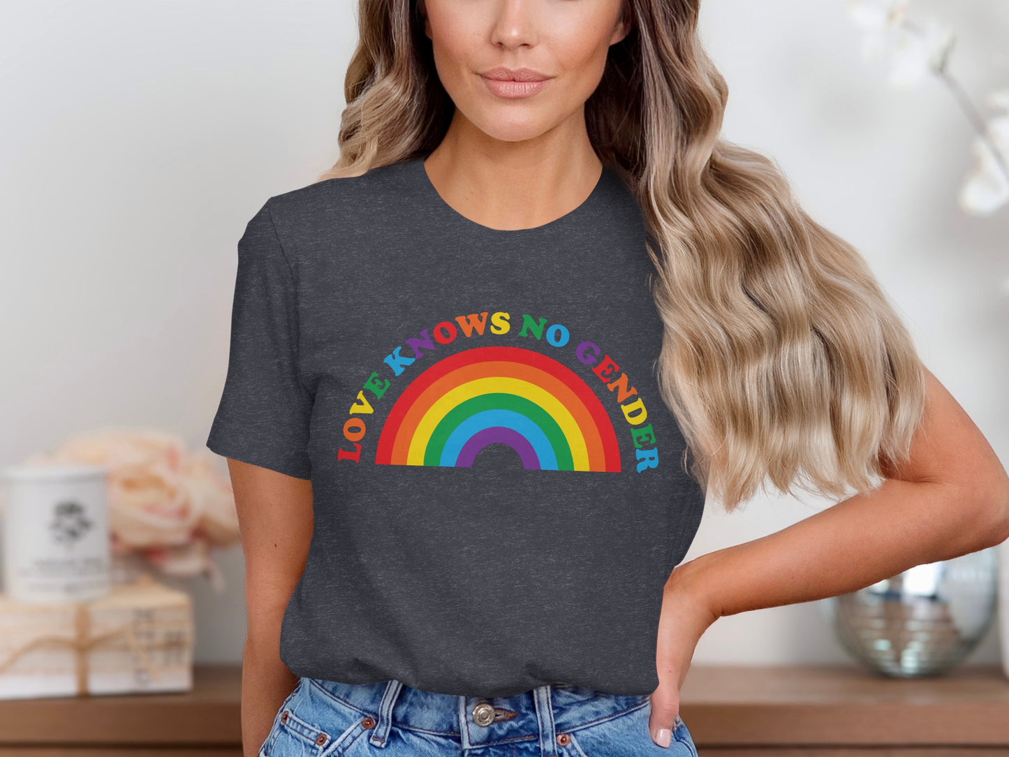 Dark grey t-shirt with rainbow and text "LOVE KNOWS NO GENDER".