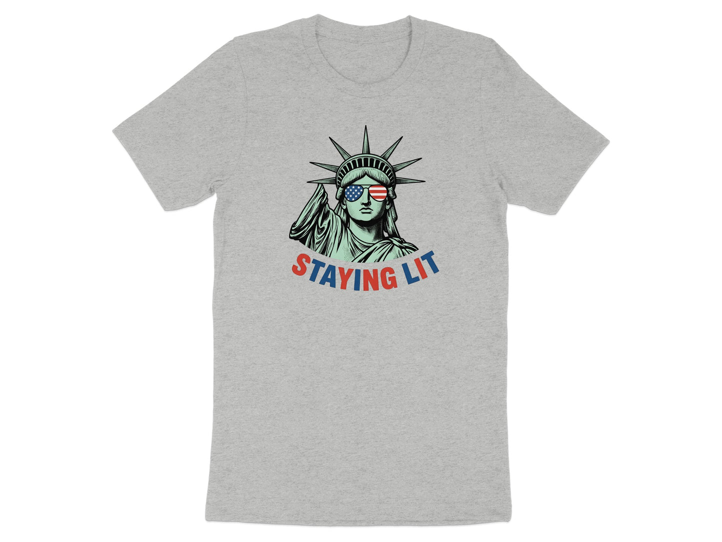 Statue of Liberty wearing sunglasses with American flag lenses, "STAYING LIT" text.