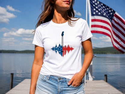 White t-shirt with American flag guitar graphic, worn by a woman outdoors.
