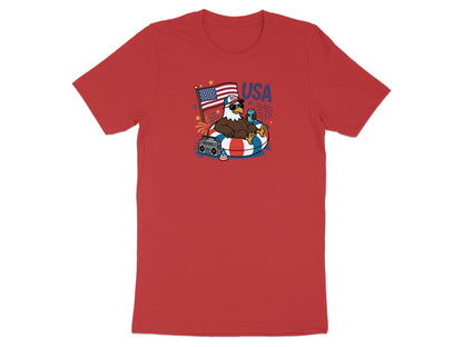 Red t-shirt with patriotic eagle floating in inner tube, holding fireworks.