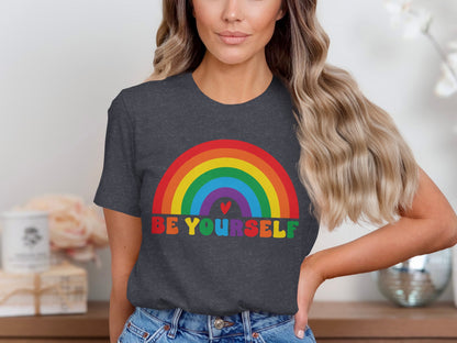 Dark t-shirt with rainbow and "BE YOURSELF" text