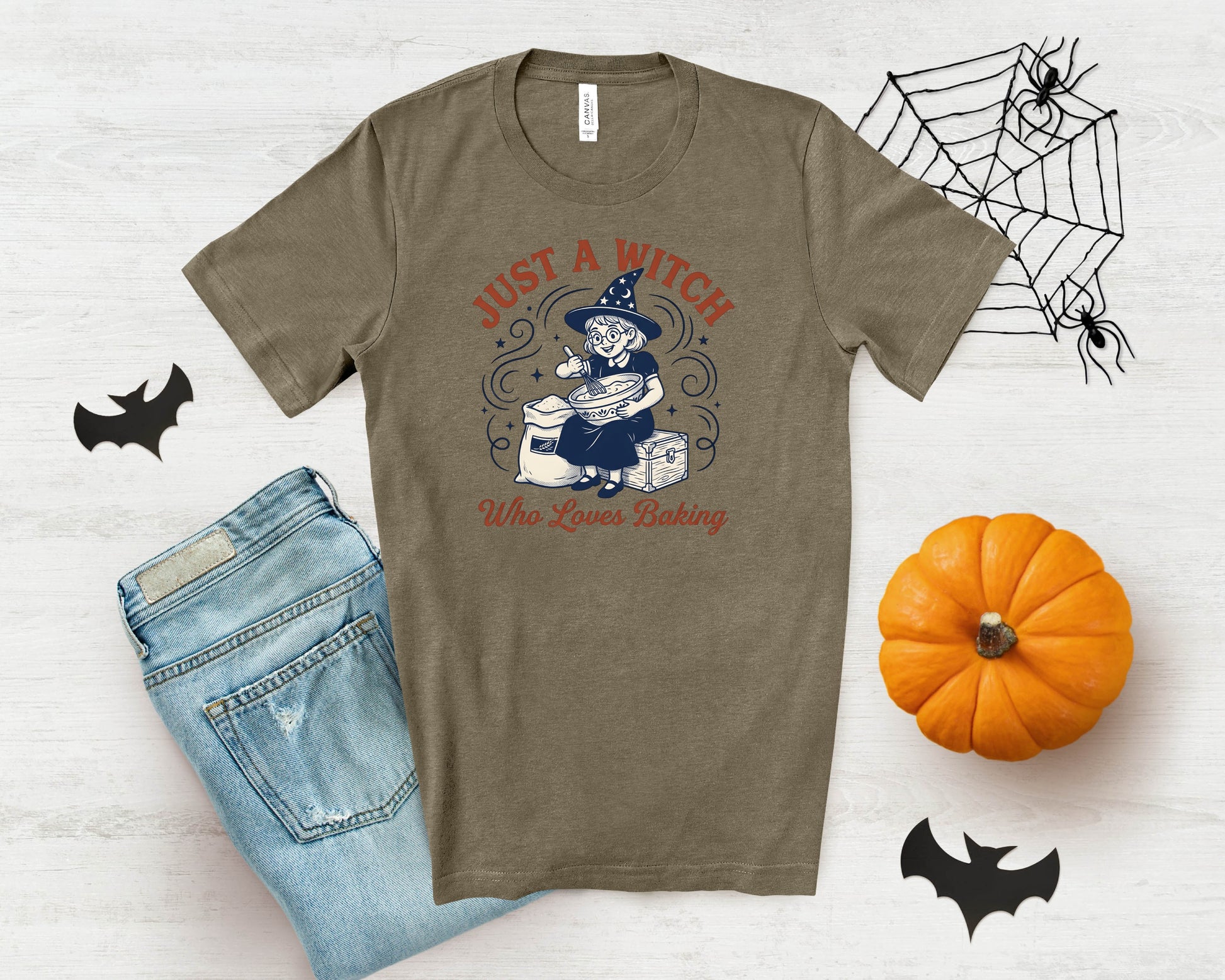 T-shirt with cartoon witch baking and text "JUST A WITCH Who Loves Baking".