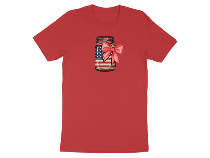Mason jar filled with American flag design, tied with a pink bow.