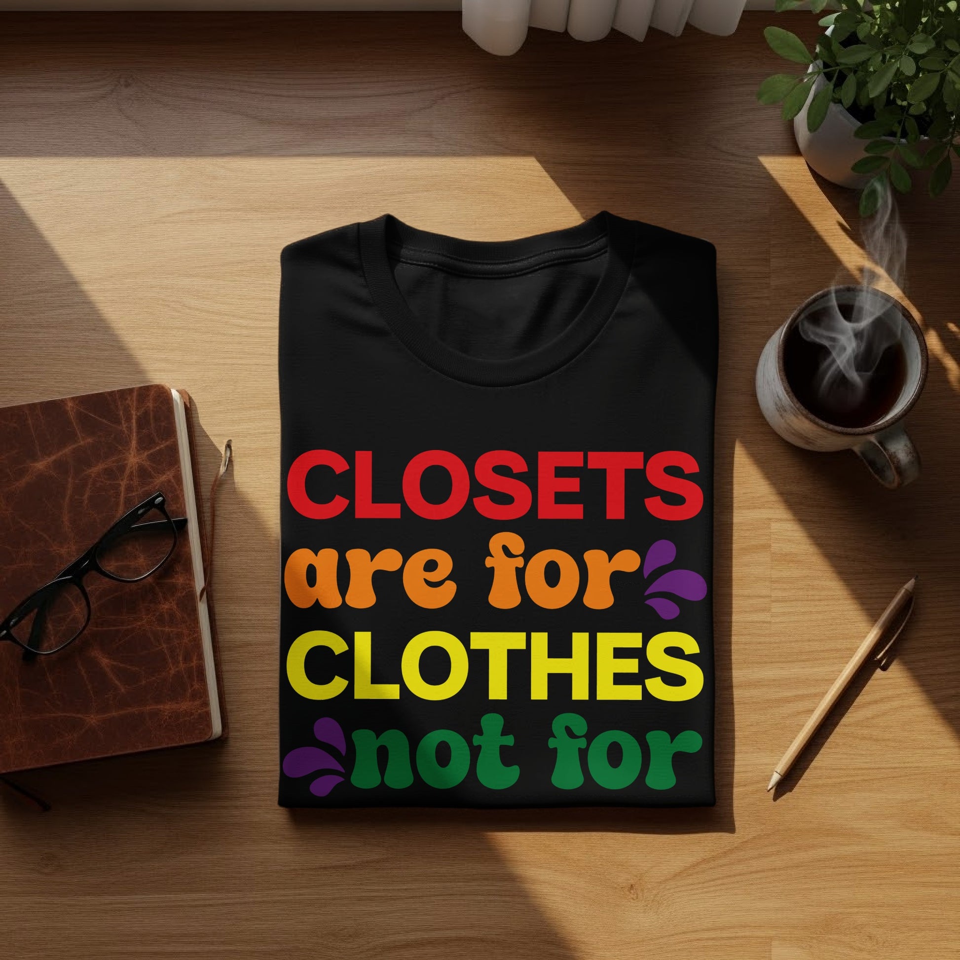Black t-shirt with colorful text "Closets are for clothes not for".