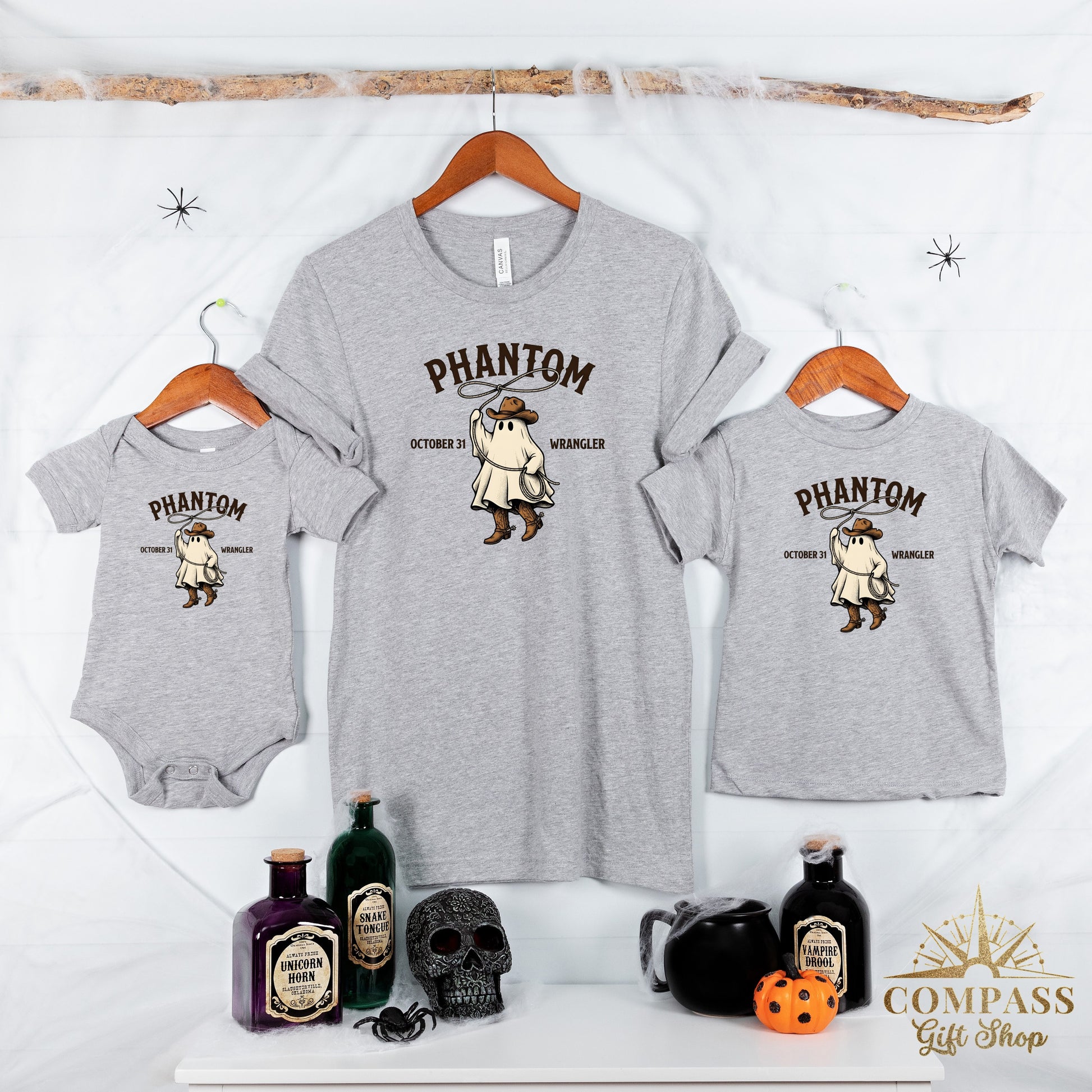 Grey toddler and adult t-shirts with ghost cowboy graphic and "Phantom Wrangler" text.