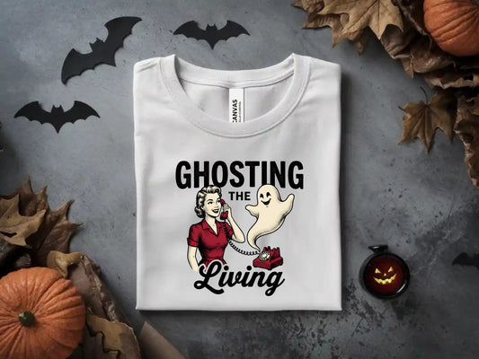 White t-shirt with "Ghosting The Living" graphic featuring a woman on a retro red phone and a ghost.