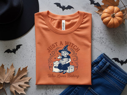 Orange t-shirt with "Just A Witch Who Loves Baking" text and witch illustration.