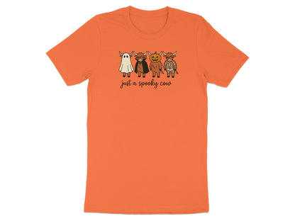 Orange t-shirt with spooky highland cows dressed as a ghost, vampire, pumpkin and skeleton.