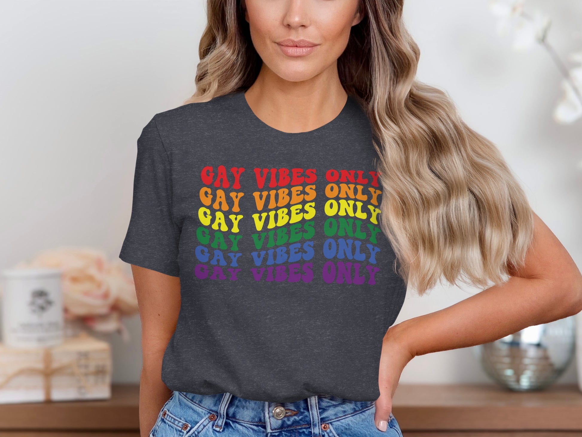 Dark gray t-shirt with "GAY VIBES ONLY" in rainbow gradient text.