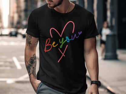 Black t-shirt with colorful "Be you" heart graphic and "X" symbol.