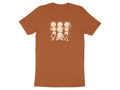Orange t-shirt with a graphic of three dancing skeletons and stacked skulls.