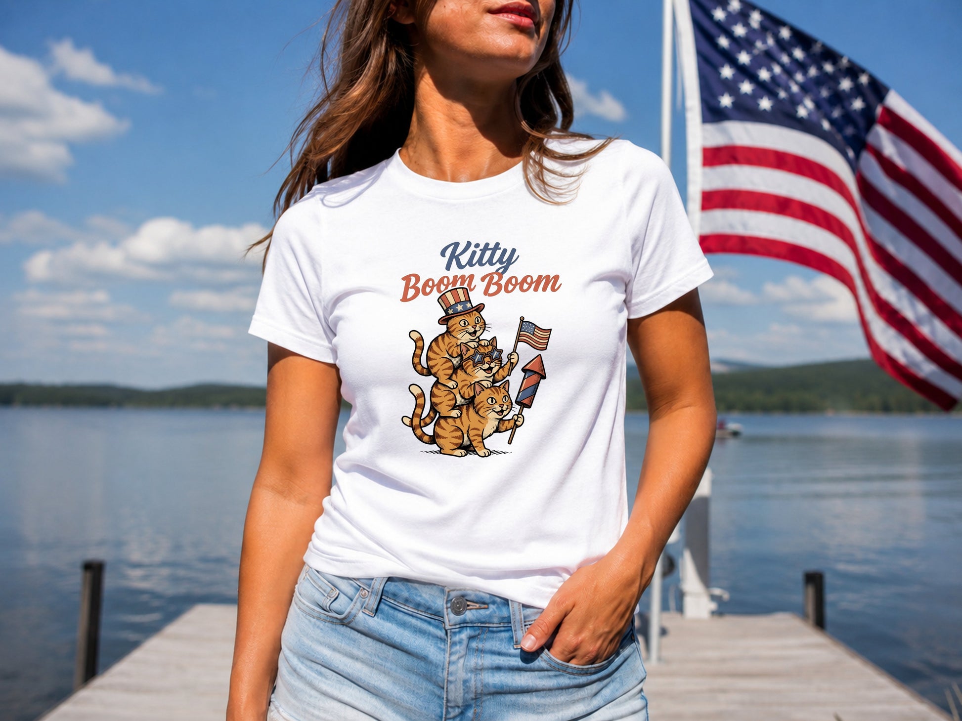 White t-shirt with "Kitty Boom Boom" and cats holding fireworks.