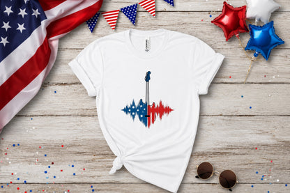 White t-shirt with a red, white, and blue guitar soundwave graphic.