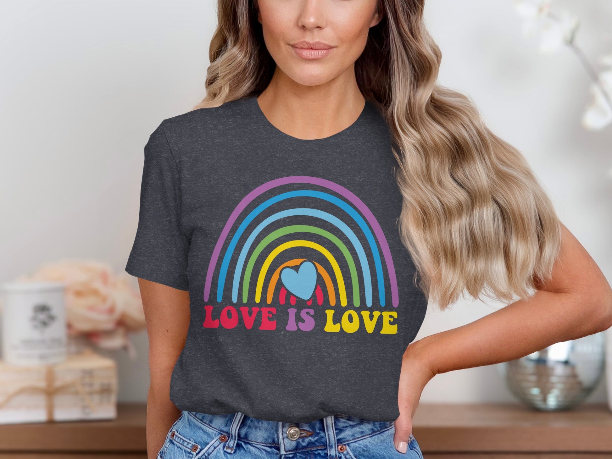 Dark grey t-shirt with a rainbow and heart, reading "LOVE IS LOVE".