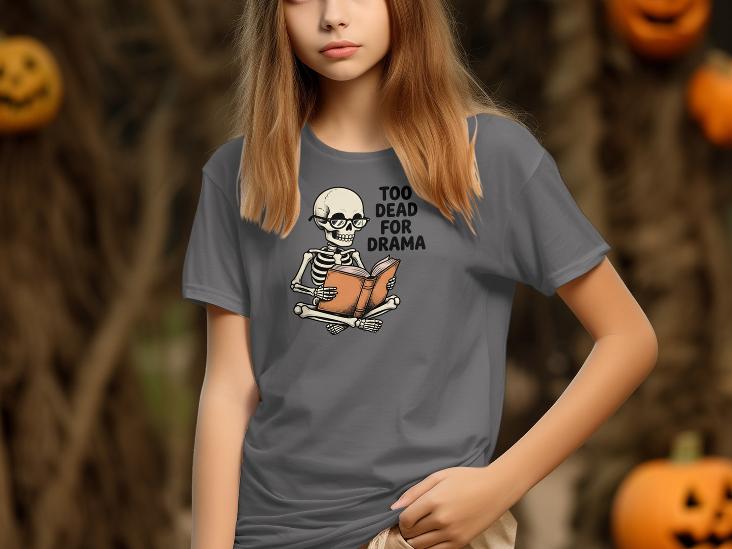 Grey t-shirt with skeleton reading book and text "Too Dead For Drama".