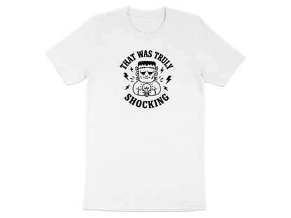 White t-shirt with Frankenstein holding a lightbulb, text "THAT WAS TRULY SHOCKING".
