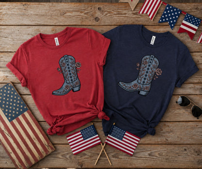 Two cowboy boots with floral designs, one red and one navy shirt.