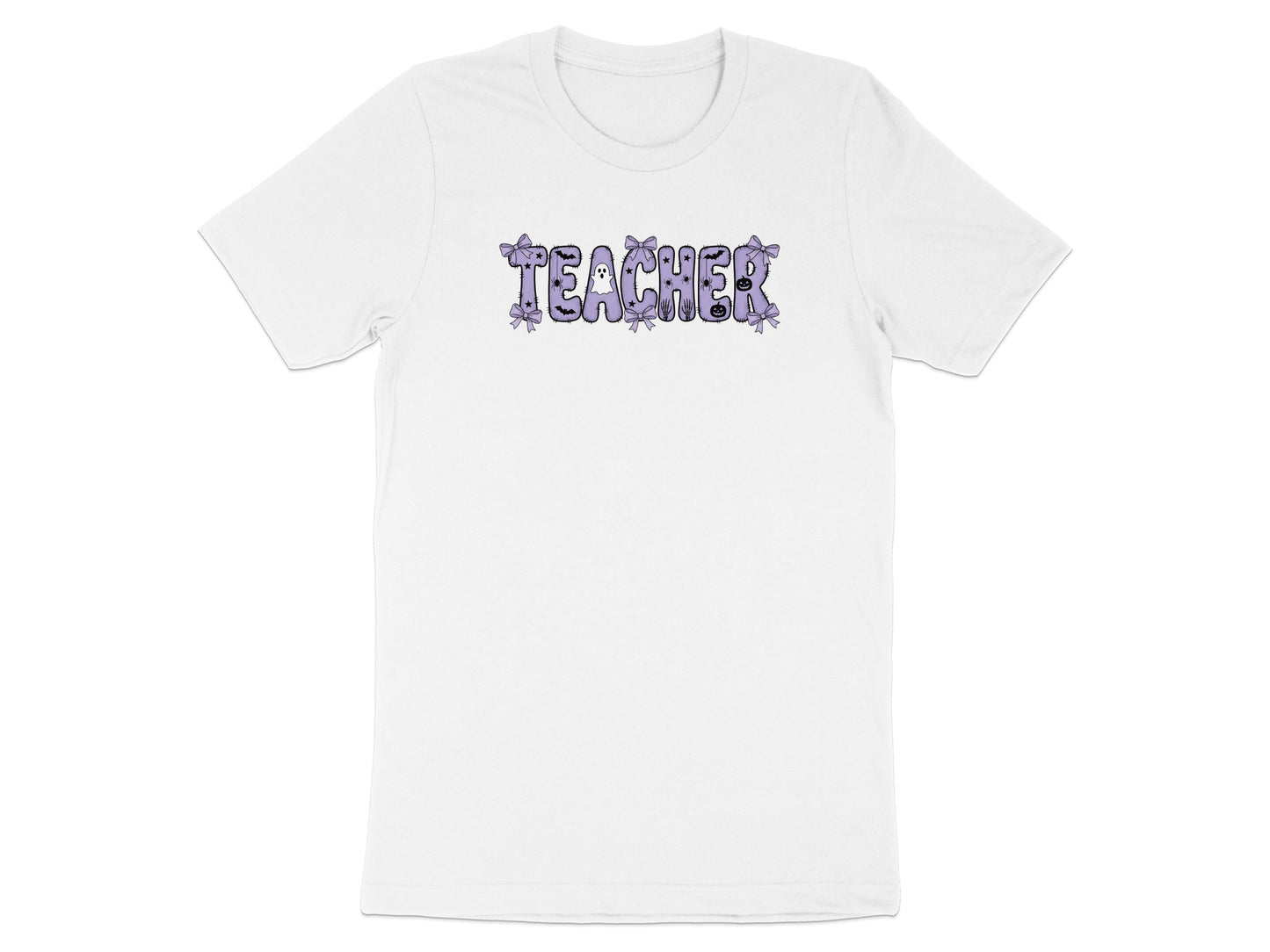 White t-shirt with "TEACHER" text in purple with Halloween-themed embellishments.