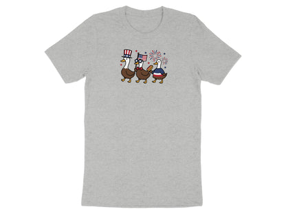 Three cartoon ducks in patriotic attire marching with a US flag.
