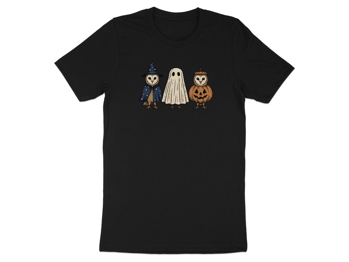 Black t-shirt with owls dressed as a witch, ghost, and jack-o'-lantern.