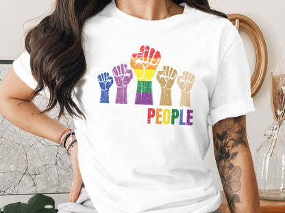 White t-shirt with rainbow raised fists and "Love Is Love" text.