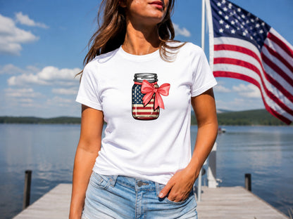 White t-shirt with mason jar graphic featuring American flag and pink bow.