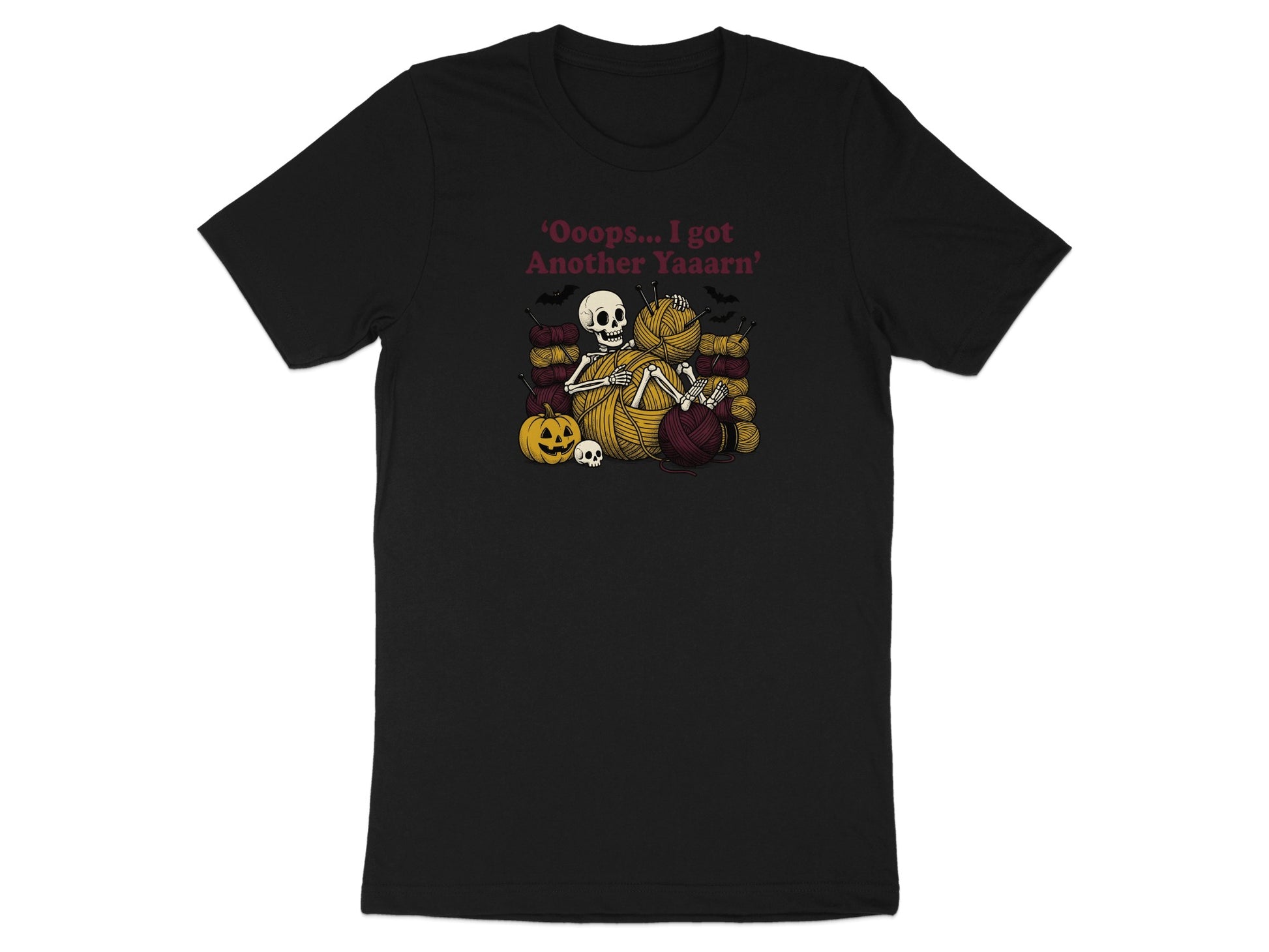 Skeleton knitting with yarn, bats, pumpkin, and skull. Text: "Ooops... I got Another Yaaarn".