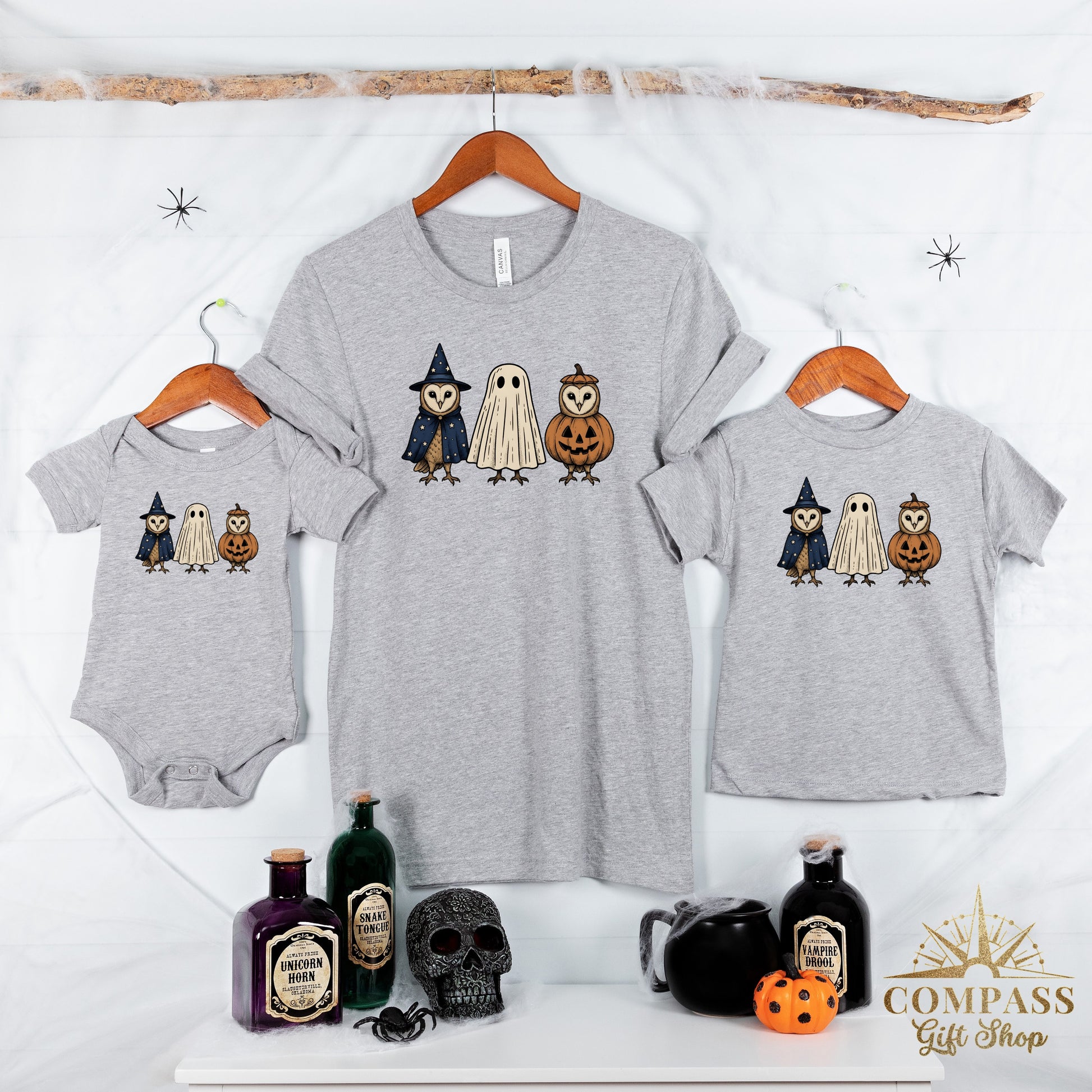 Three grey t-shirts and a baby onesie feature owls dressed as a witch, a ghost, and a pumpkin.