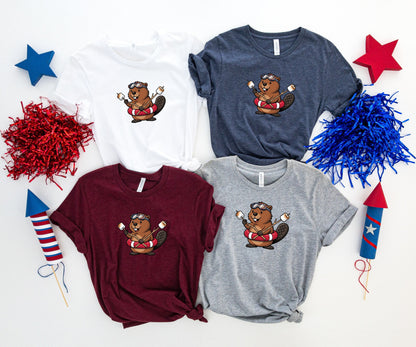 Four graphic t-shirts featuring a cartoon beaver with a life preserver.