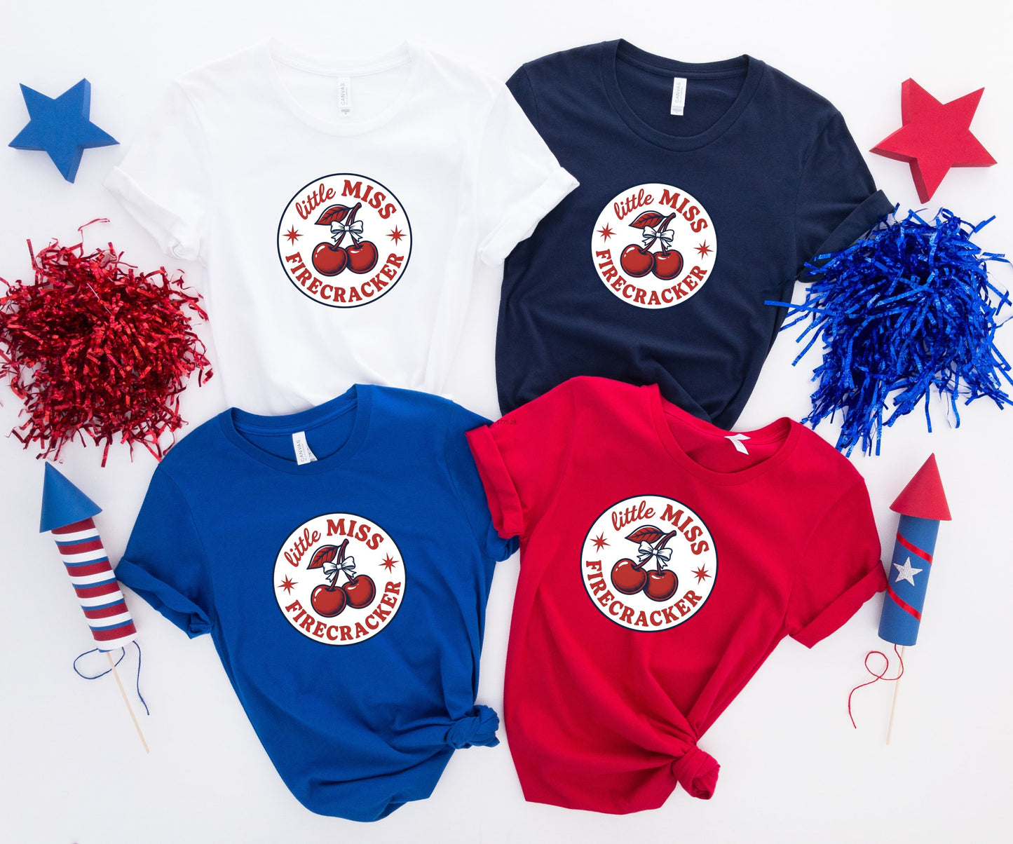 Four t-shirts: white, navy, blue, and red, each with "little Miss Firecracker" graphic.