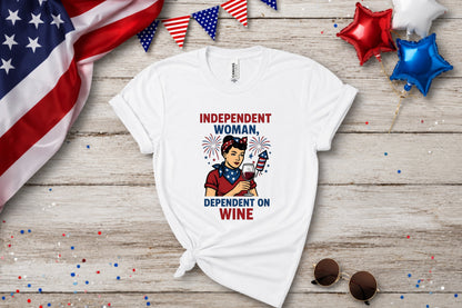 White t-shirt with "Independent Woman, Dependent on Wine" graphic, celebrating with fireworks.
