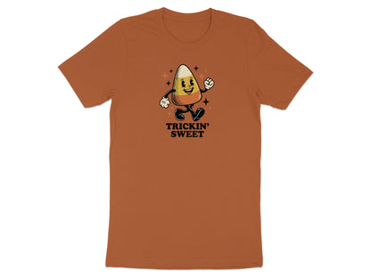 Brown t-shirt with a cartoon candy corn with the text "TRICKIN' SWEET".
